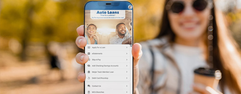 happy woman showing phone screen to viewers